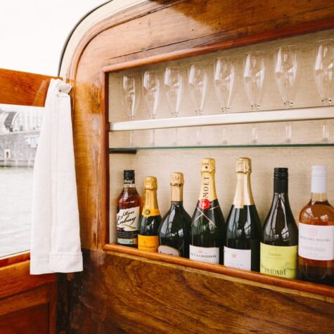 The onboard bar aboard the Barbarella with a row of champagne and wine.